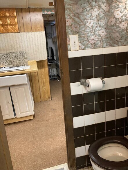 Lavatory exit into kitchenette - 764 Lenore Ln