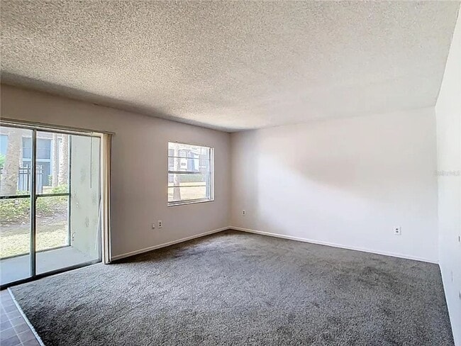 Building Photo - 2BR Condo Near UCF – All-Inclusive Living & Resort Amenities!