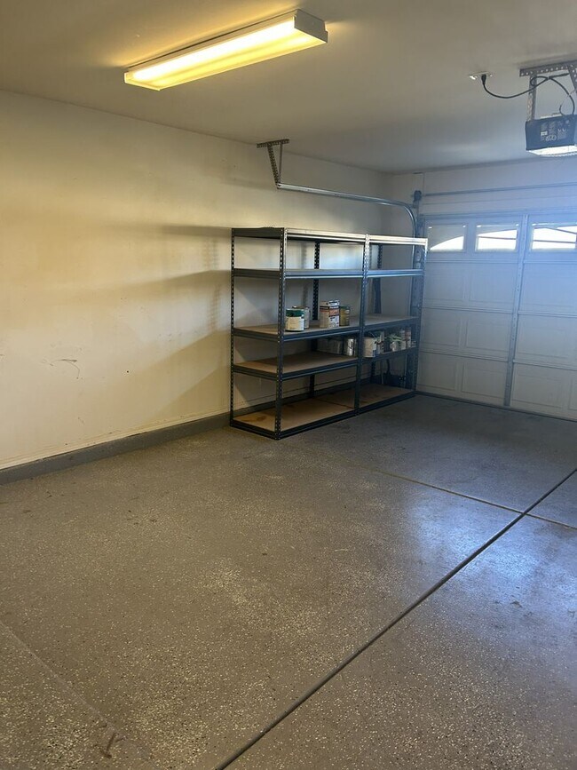 Building Photo - Unfurnished four bedroom large home!  Three car garage