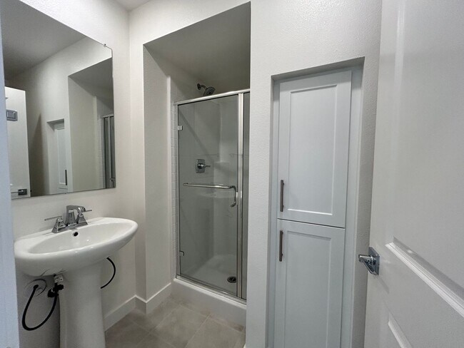 Building Photo - Gorgeous, 3 level townhome, featuring 2 car garage central Air, and in Unit laundry.
