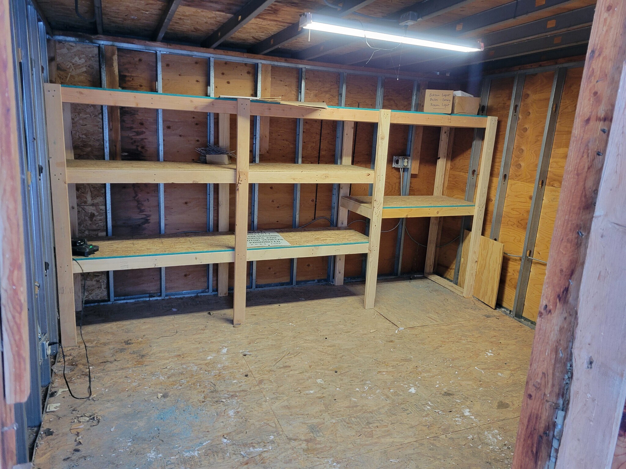 Storage shed in back yard with plenty of shelving space for your use - 1170 Racine Street