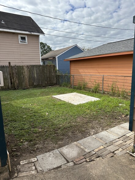 Backyard with Cement Patio - 7334 Lamar St