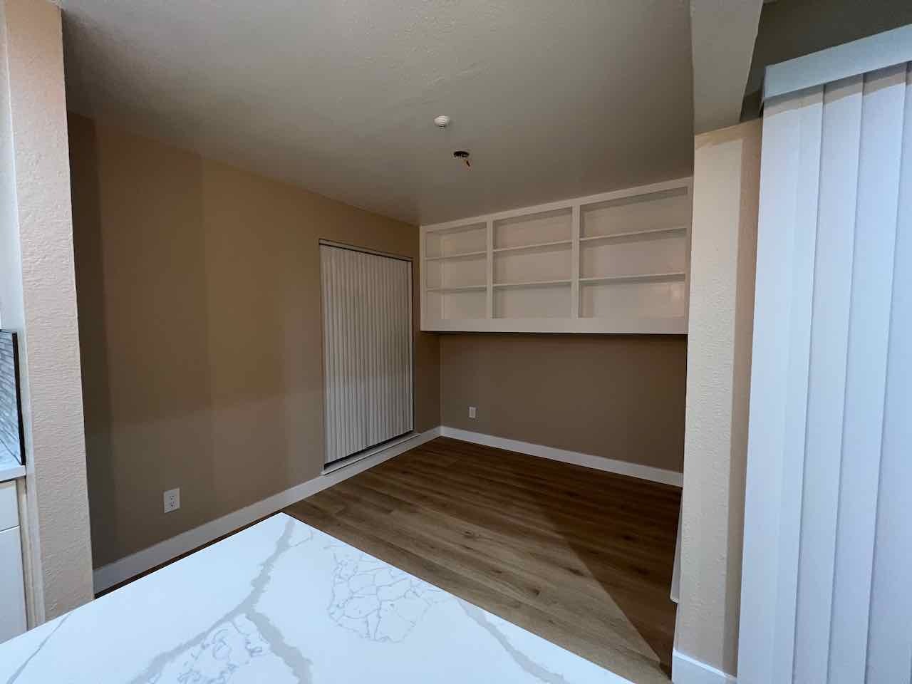 Dining room with beautiful shelving. Light to be installed before move-in. - 3183 Wayside Plz