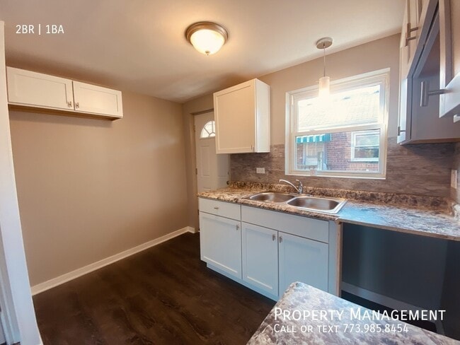 Building Photo - 8153 S Colfax Ave