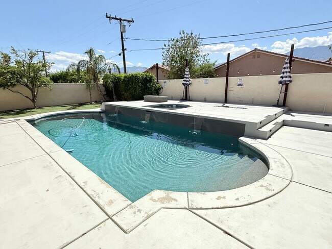 Building Photo - Spacious 4-Bedroom Home with Pool & Spa in...