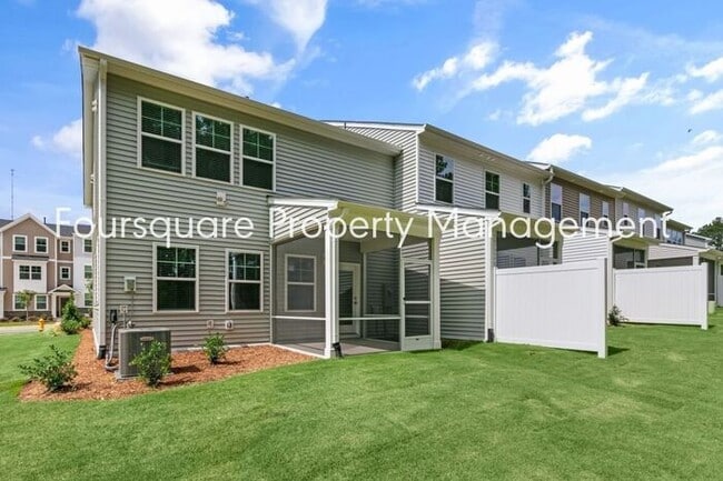Building Photo - Coming Soon; July 27, 2026 : End unit ToSpacious End-Unit Townhome with 2nd Floor Loft, Screened-...