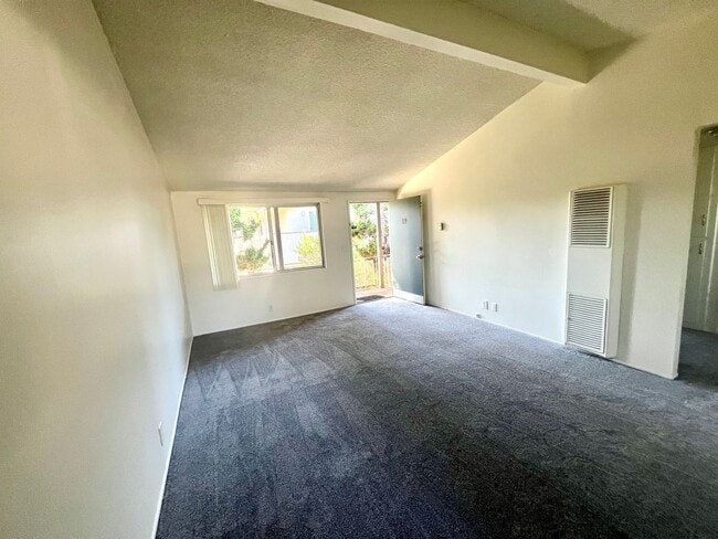 Building Photo - Spacious Two Bedroom with New Carpet - Available Now!