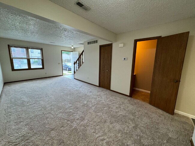 Building Photo - Love Grows — Spacious 2-Story Townhome