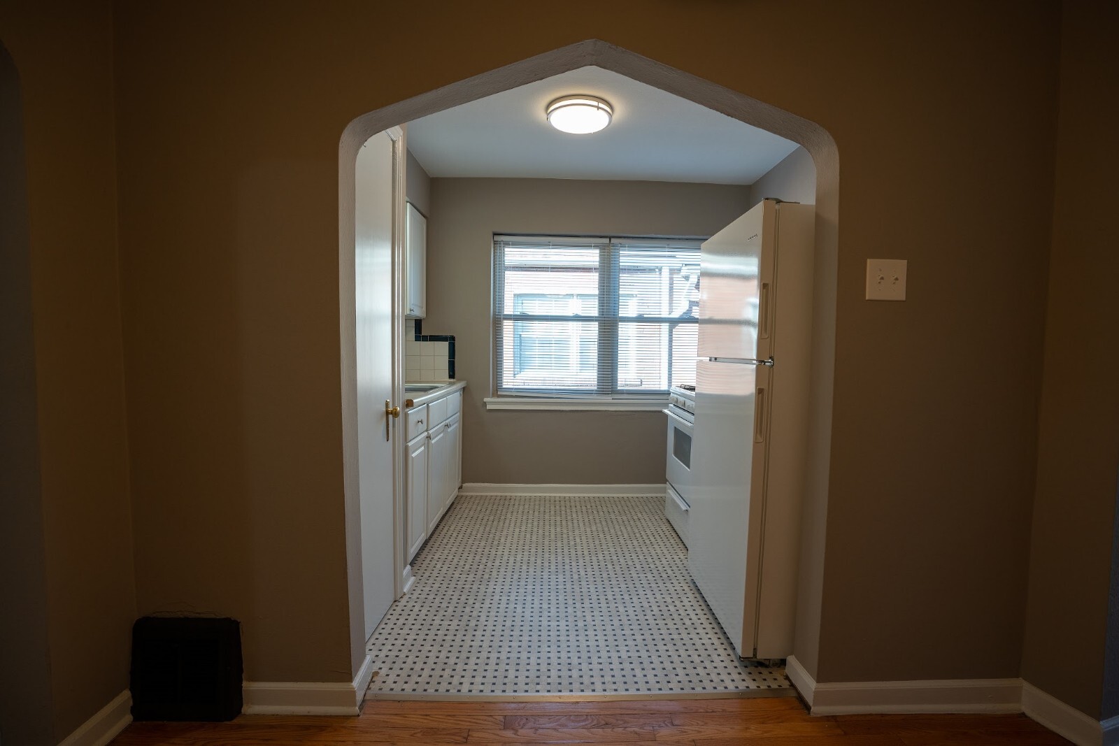 Galley kitchen with refrigerator - 5608 Chippewa St