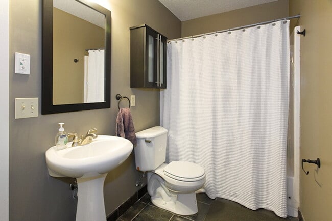 Building Photo - Spacious 5-Bedroom Minneapolis Gem with Gas Fireplace & Finished Basement