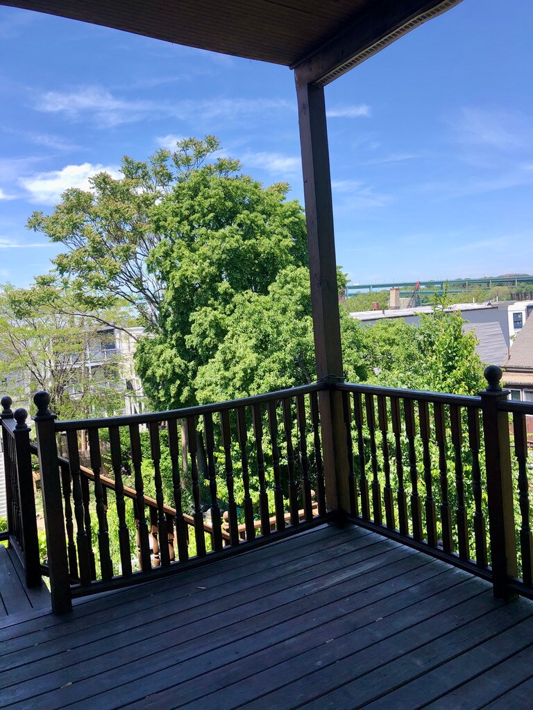 Unit two: left-side point-of-view from private patio/deck with emergency exit staircase access.. - 34 Falcon St