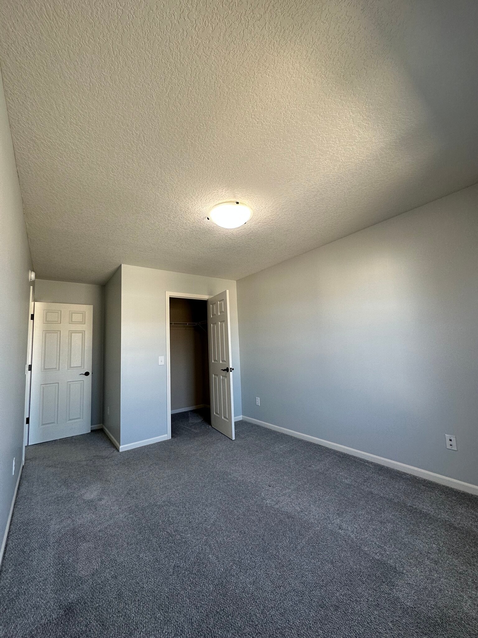 Bedroom 1 far view - 411 Treeline Cv