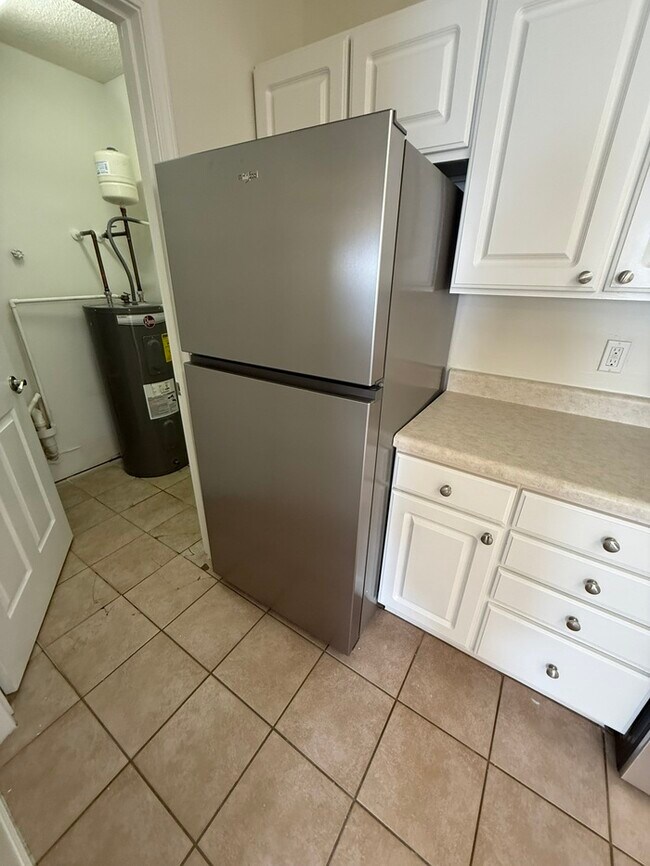 Building Photo - Adorable 1 Bed 1.5 Bath Condo in Brier Creek! 1st Floor! Sun Room! New Appliances!