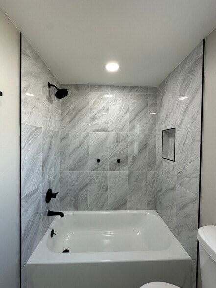 Modern Bath with Bold Black Finishes - 1331 W Speedway Blvd