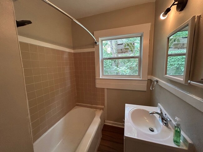 Building Photo - Freshly Painted 2x1 with Brand-New Plank Floors