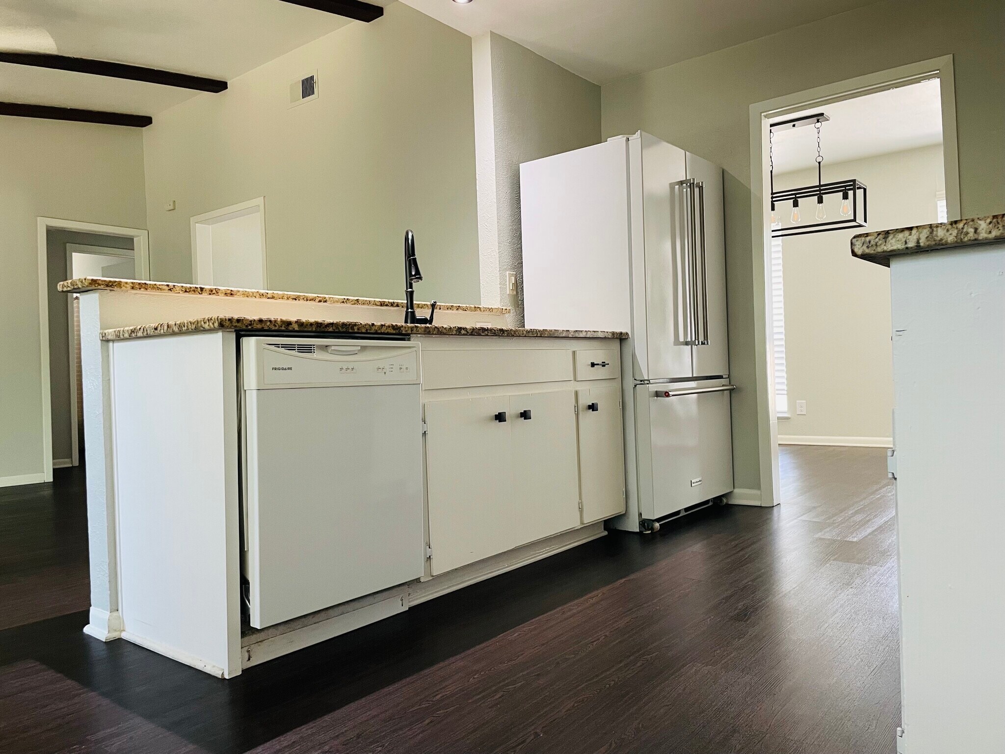 Kitchen opens to living room - 6717 Tulsa Cove
