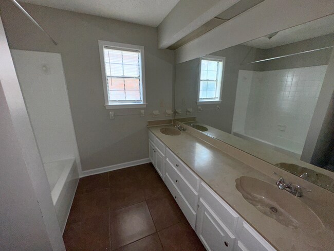 Building Photo - Grand 4BR/2BA Near Southwind | 2,438 Sq Ft, Stone Fireplace, Soaking Tub & 2-Car Garage