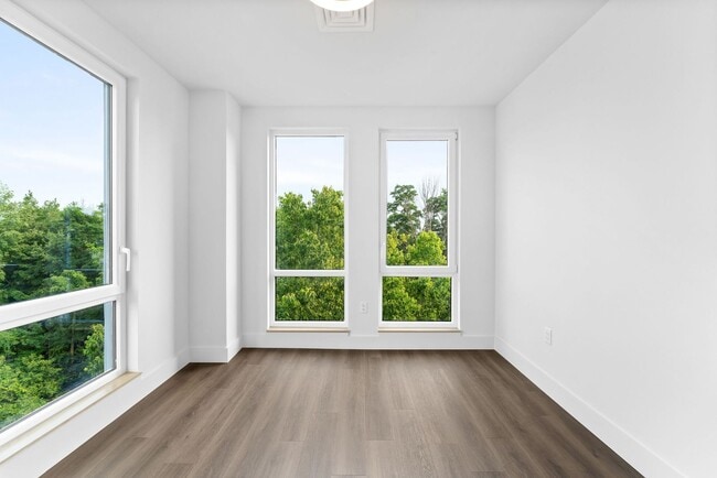 Building Photo - 2 Bedroom Corner-Unit with Wooded Balcony ...