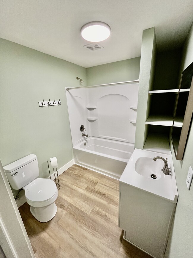 Brand new bath with DEEP shelving. - 1401 W 13th Ave