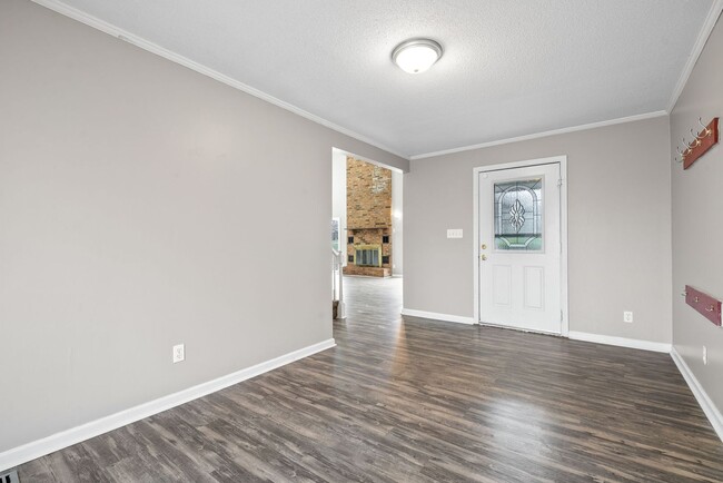 Building Photo - Lovely home on beautiful, wooded corner - Just Reduced