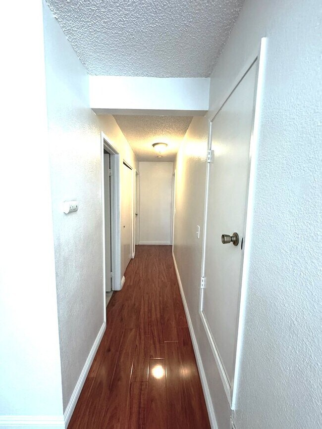 Building Photo - 2 Bedroom, 2 Bath Upstairs Condo with Private Balcony & 2-Car Garage, Gated Community, Water/Tras...