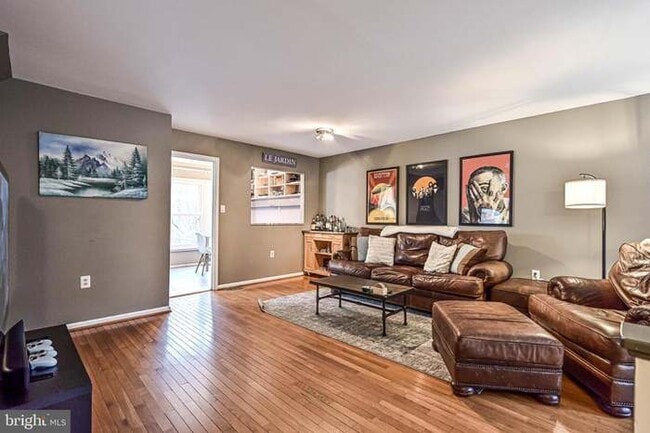 Living Room FURNISHED: w/ couch, coffee table, bar cart and TV stand - 3814 Usher Ct