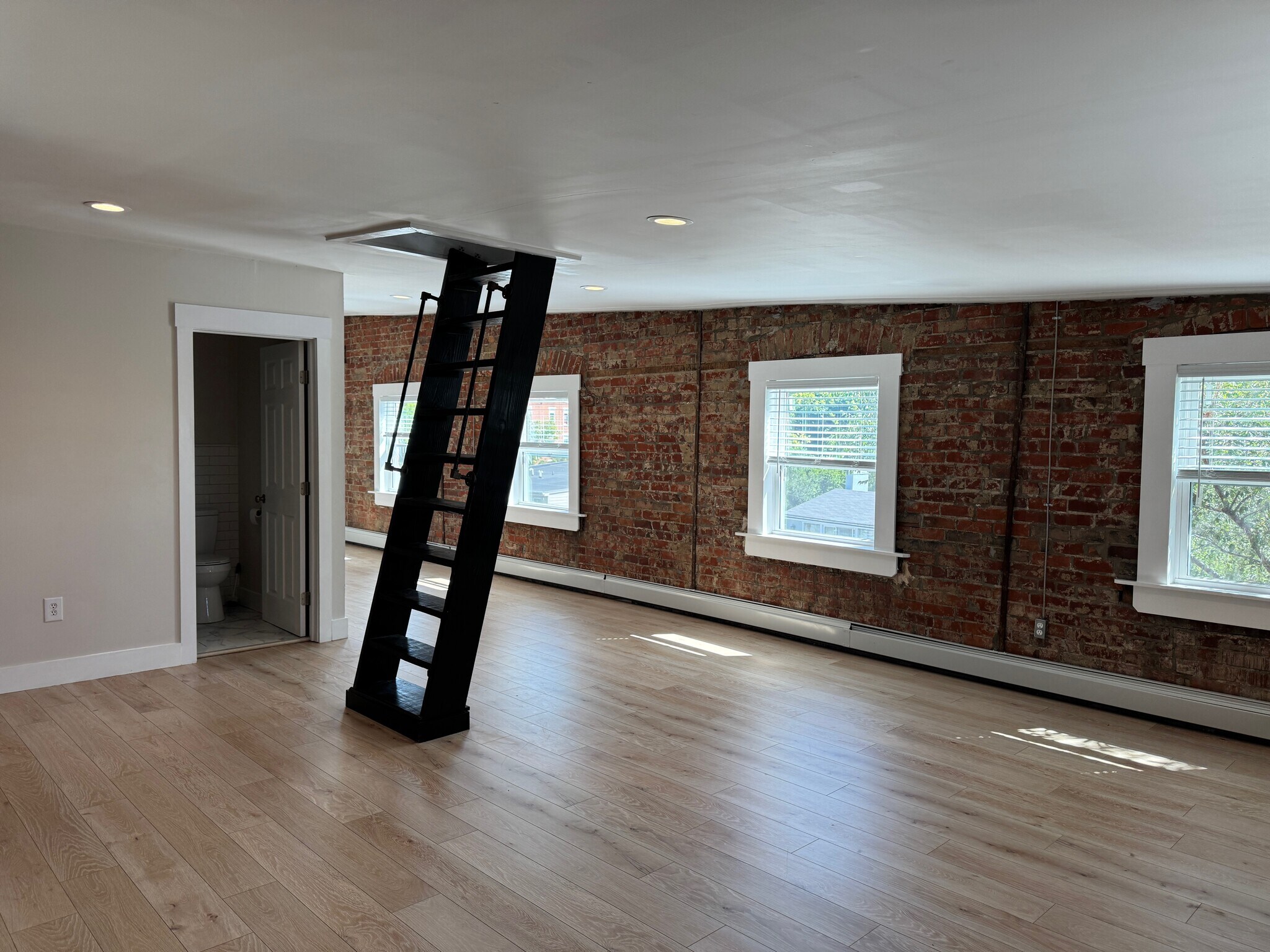 Living room with stationery ladder to enjoy views all seasons - 427 Klotter Ave