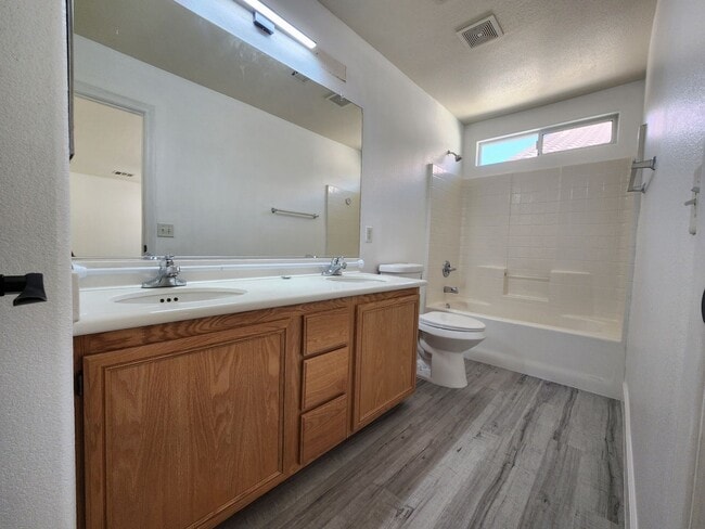 Building Photo - Sleek 2 story home with tile in most living areas and upgraded kitchen.