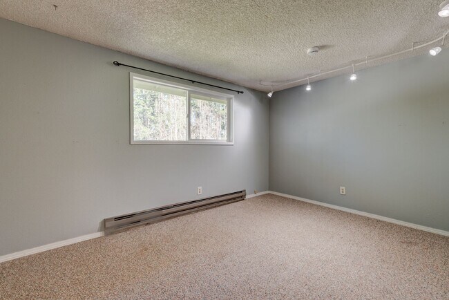 Building Photo - Spacious 4-Bedroom Home with Fireplace, Fenced Yard, and 2-Car Garage