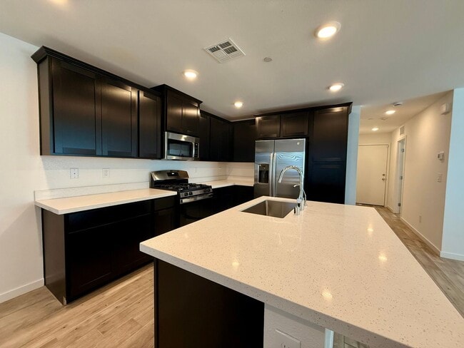 Building Photo - 4 BED 3 BATH 2 CAR GARAGE TOWNHOUSE + LOFT ON CORNER LOT w/ BALCONY