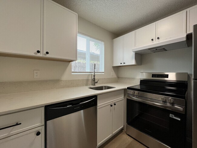 Building Photo - Inviting 2 Bedroom Home with Open Layout, Stainless Steel Appliances & Private Outdoor Retreat
