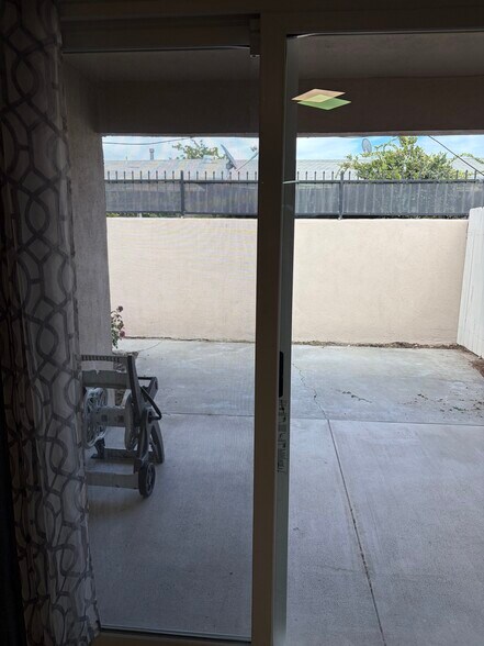 Fully fenced small backyard with patio - 375 Vernon Drive