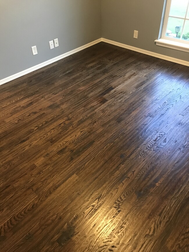 Hardwood floors installed in bedrooms, closets and small hallways in 2023 - 7303 S Laurel Pl