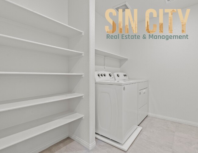 Building Photo - "Charming 4-Bed Home on Love Springs Ln: Spacious 1865 Sq Ft with 2.5 Baths in North Las Vegas!"