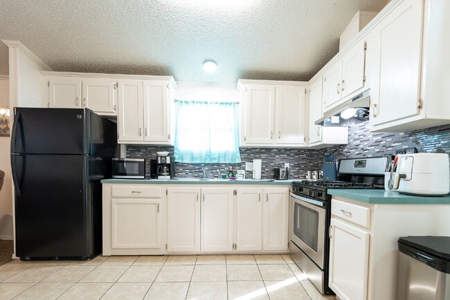 Building Photo - Your Private Theater & 2BR Escape – Where ...