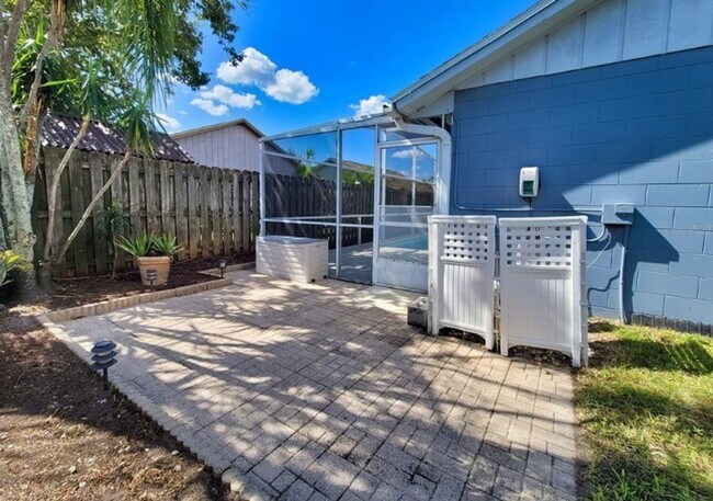 Building Photo - Charming 3-Bedroom Home with Pool, 2-Car Garage, and Tile Flooring Throughout!