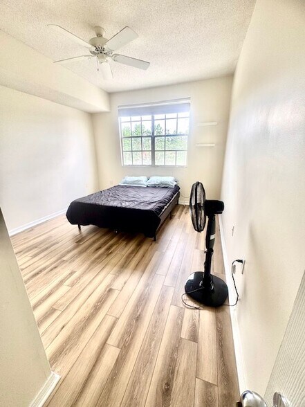 second bedroom with new floors - 5601 Bentgrass Dr