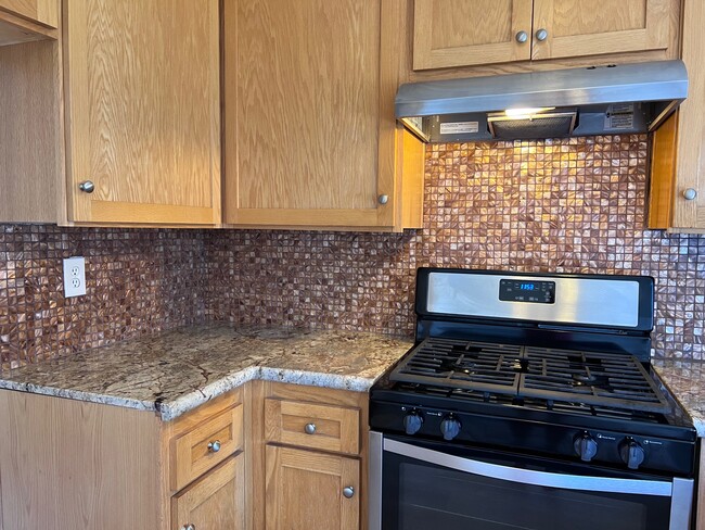 New stainless steel oven and beautiful Mother of Pearl backsplash - 2356 Canyon Park Dr