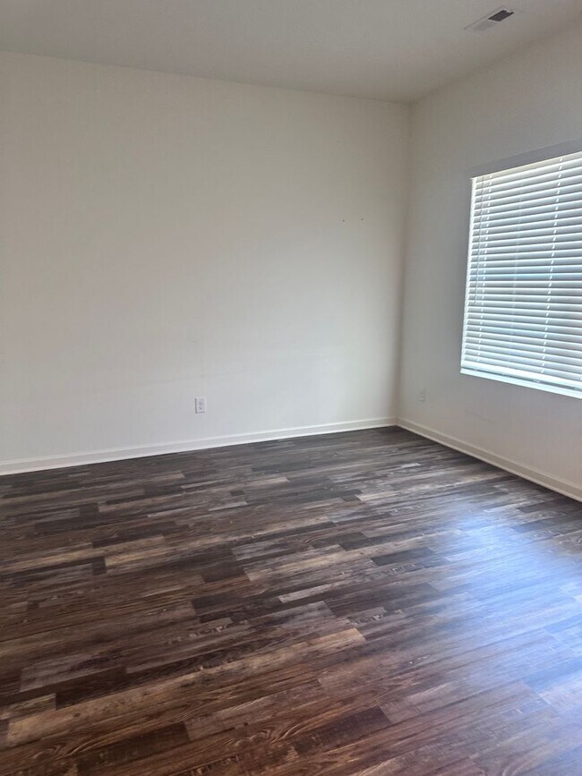Building Photo - efficient two-level home provides a large living room, 4 very spacious bedrooms, and 2.5 bathrooms