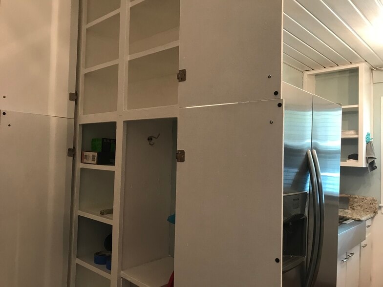 Large 4 door pantry in the kitchen holds lots of canned goods and staples - 1407 W Church St