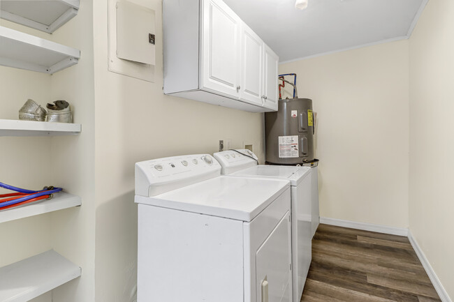 Laundry room with lots of cabinet space - 5393 Treetops Dr