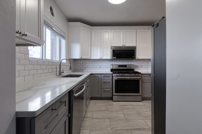 Building Photo - Storybook Tudor New Renovated | Two Full Kitchens | Full Finished Basement