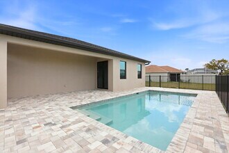 Building Photo - New Construction 3/2 Pool Home on Canal, $2,699, NW Cape Coral. The Only Thing Used Here Is the W...