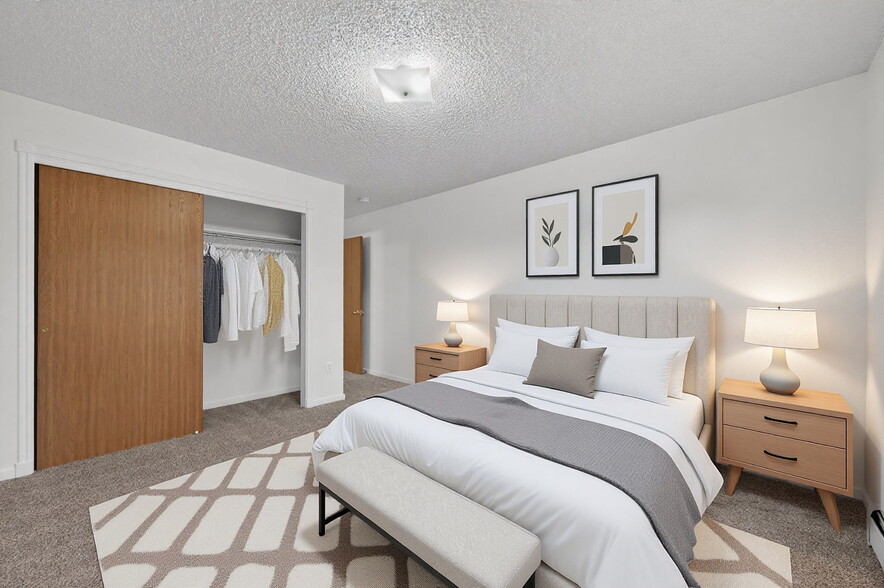two spacious bedrooms featuring new carpet - 4502 E 12th St