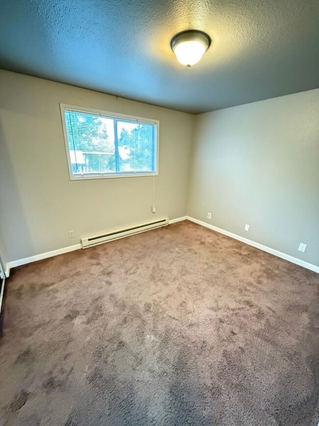 Building Photo - Update Two Bedroom on the First Floor with Covered back patio!