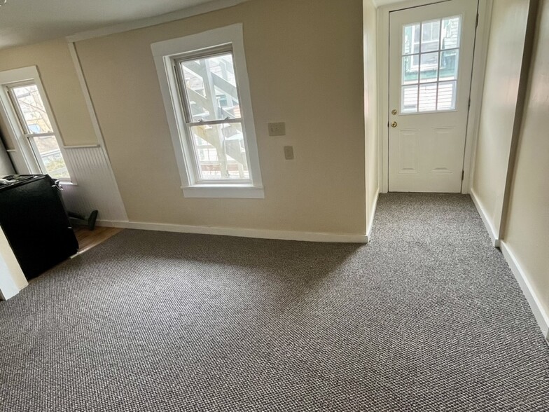 Dining/living room with rear door - 29 Pine St