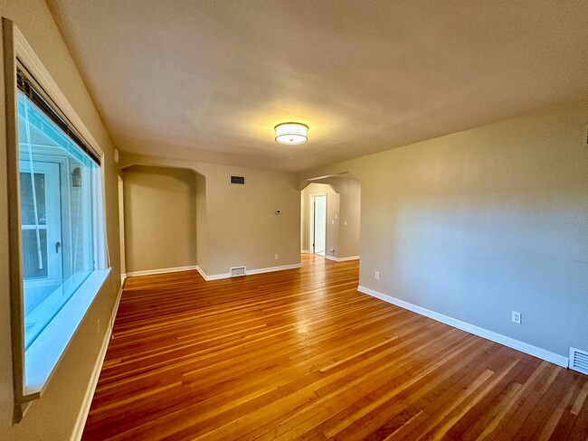 Building Photo - Stunning 2 level home with wood floors and...