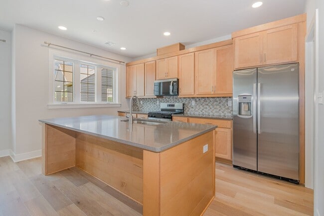 Building Photo - Modern 2025 Townhome | Open-Concept Living, Chef’s Kitchen with Large Island & 2-Car Garage