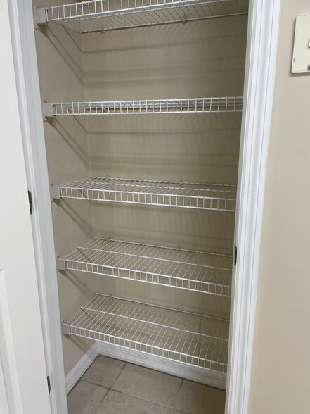 Kitchen pantry with wire shelving. - 13200 W Newberry Rd