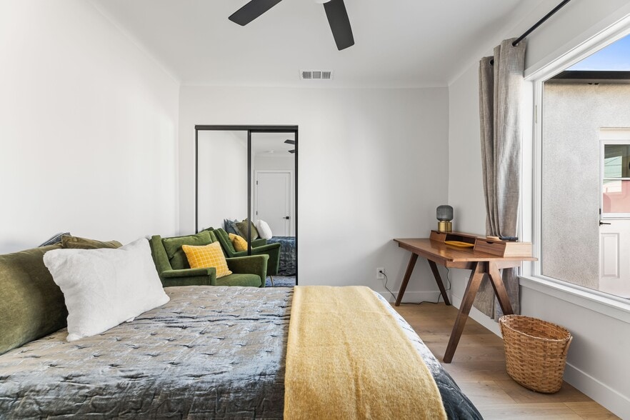 3rd bedroom w/ large closet, West Elm furniture/bedding, desk for the possibility to work from home. - 1823 N Ditman Ave